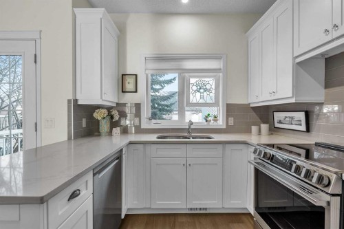 60 Inverness Square Se, Calgary, AB - Indoor Photo Showing Kitchen With Double Sink