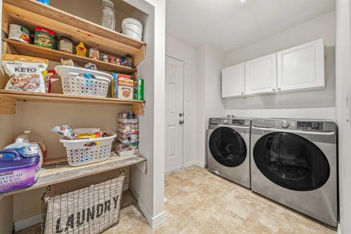 31 Jumping Pound Rise, Cochrane, AB - Indoor Photo Showing Laundry Room