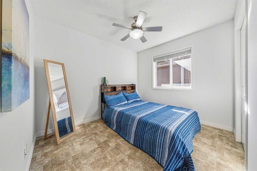 31 Jumping Pound Rise, Cochrane, AB - Indoor Photo Showing Bedroom