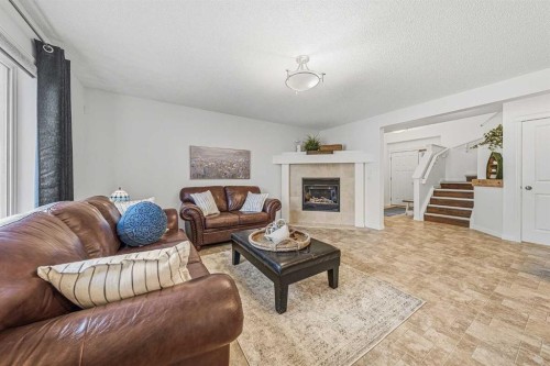 31 Jumping Pound Rise, Cochrane, AB - Indoor Photo Showing Living Room
