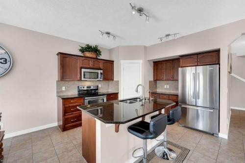 88 Silverado Saddle Avenue Sw, Calgary, AB - Indoor Photo Showing Kitchen With Stainless Steel Kitchen With Double Sink