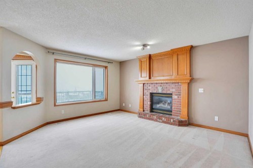 50 Hampstead Gardens Nw, Calgary, AB - Indoor Photo Showing Living Room With Fireplace