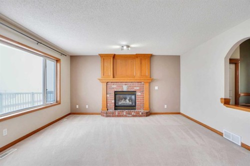 50 Hampstead Gardens Nw, Calgary, AB - Indoor Photo Showing Living Room With Fireplace