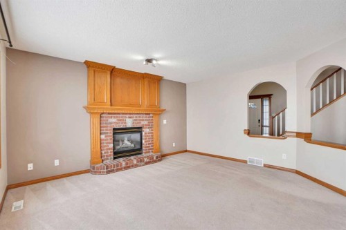50 Hampstead Gardens Nw, Calgary, AB - Indoor Photo Showing Living Room With Fireplace