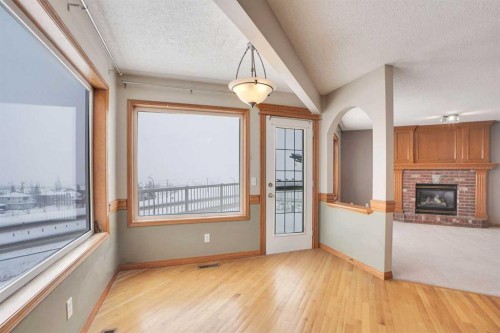 50 Hampstead Gardens Nw, Calgary, AB - Indoor Photo Showing Other Room With Fireplace