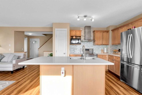 320 Evermeadow Road Sw, Calgary, AB - Indoor Photo Showing Kitchen With Stainless Steel Kitchen With Double Sink