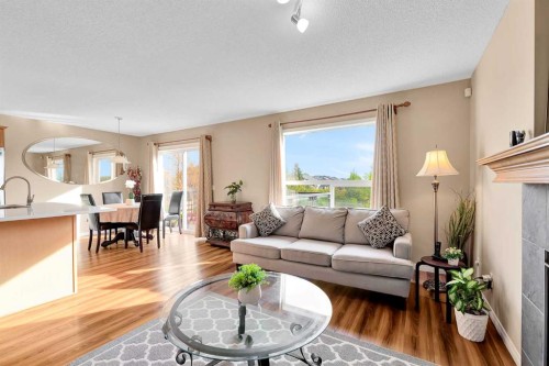 320 Evermeadow Road Sw, Calgary, AB - Indoor Photo Showing Living Room With Fireplace