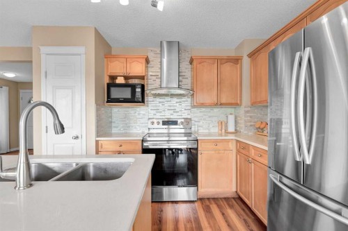 320 Evermeadow Road Sw, Calgary, AB - Indoor Photo Showing Kitchen With Stainless Steel Kitchen With Double Sink