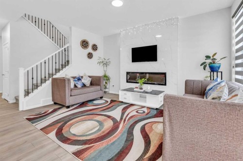 312 Edith Place Nw, Calgary, AB - Indoor Photo Showing Living Room With Fireplace