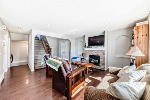 377 Cimarron Boulevard, Okotoks, AB - Indoor Photo Showing Living Room With Fireplace