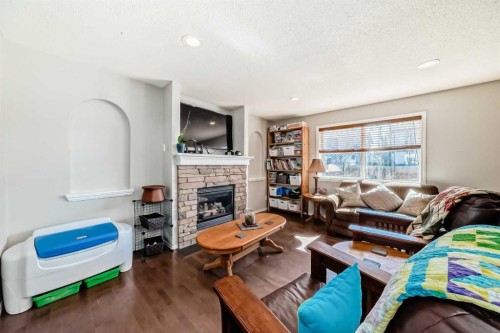 377 Cimarron Boulevard, Okotoks, AB - Indoor Photo Showing Living Room With Fireplace