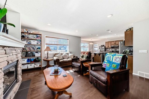 377 Cimarron Boulevard, Okotoks, AB - Indoor Photo Showing Living Room With Fireplace