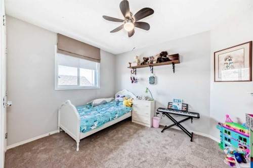 377 Cimarron Boulevard, Okotoks, AB - Indoor Photo Showing Bedroom