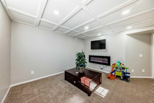 377 Cimarron Boulevard, Okotoks, AB - Indoor Photo Showing Other Room With Fireplace