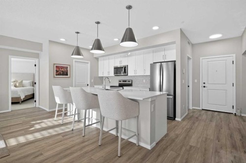 214-140 Mahogany Street Se, Calgary, AB - Indoor Photo Showing Kitchen With Stainless Steel Kitchen With Upgraded Kitchen