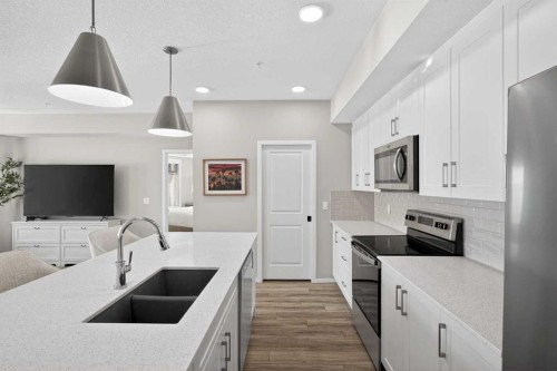 214-140 Mahogany Street Se, Calgary, AB - Indoor Photo Showing Kitchen With Double Sink With Upgraded Kitchen