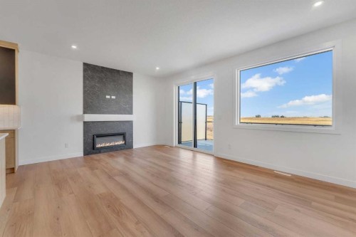 194 Muirfield Boulevard, Lyalta, AB - Indoor Photo Showing Living Room With Fireplace