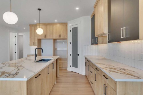 194 Muirfield Boulevard, Lyalta, AB - Indoor Photo Showing Kitchen With Double Sink With Upgraded Kitchen