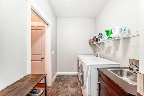 160 Sienna Passage, Chestermere, AB - Indoor Photo Showing Laundry Room