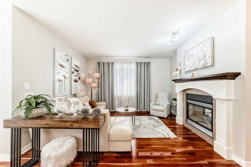 160 Sienna Passage, Chestermere, AB - Indoor Photo Showing Living Room With Fireplace