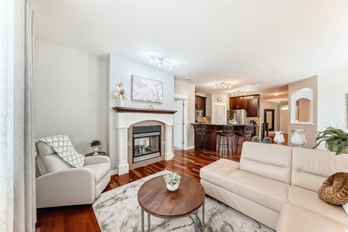 160 Sienna Passage, Chestermere, AB - Indoor Photo Showing Living Room With Fireplace