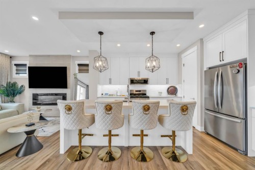 163 Sandpiper Bend, Chestermere, AB - Indoor Photo Showing Other Room With Fireplace