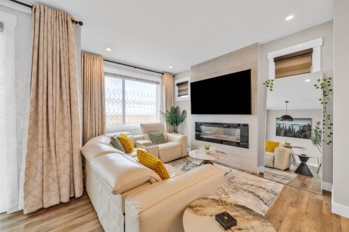 163 Sandpiper Bend, Chestermere, AB - Indoor Photo Showing Living Room With Fireplace