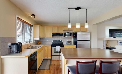 95 Covepark Place Ne, Calgary, AB - Indoor Photo Showing Kitchen With Double Sink