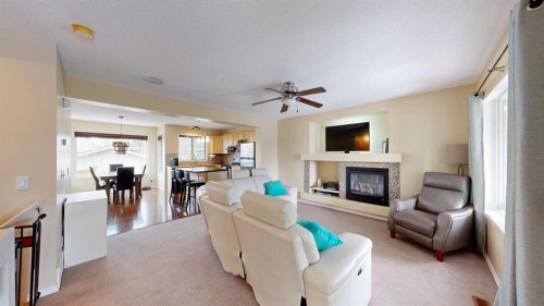 95 Covepark Place Ne, Calgary, AB - Indoor Photo Showing Living Room With Fireplace