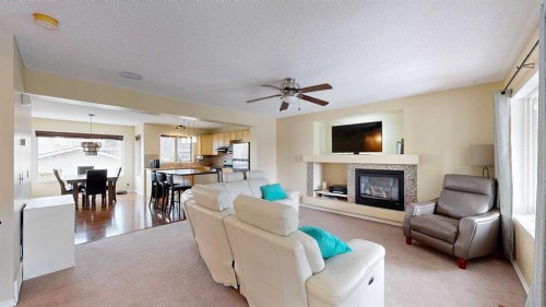 95 Covepark Place Ne, Calgary, AB - Indoor Photo Showing Living Room With Fireplace