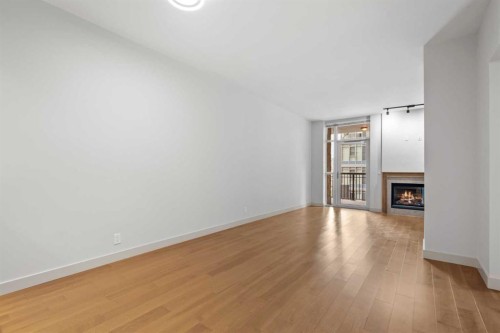 317-222 Riverfront Avenue Sw, Calgary, AB - Indoor With Fireplace