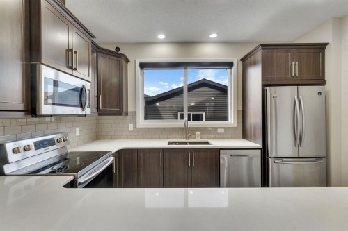 289 Cornerstone Passage Ne, Calgary, AB - Indoor Photo Showing Kitchen With Double Sink With Upgraded Kitchen