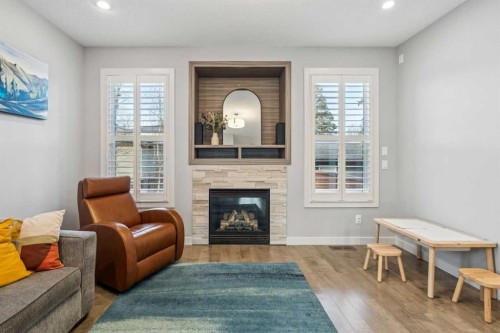 127 34 Street Nw, Calgary, AB - Indoor Photo Showing Living Room With Fireplace