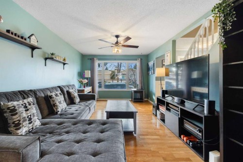 16 Midridge Gardens Se, Calgary, AB - Indoor Photo Showing Living Room
