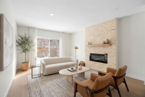 24 Hawkwood Crescent Nw, Calgary, AB - Indoor Photo Showing Living Room With Fireplace