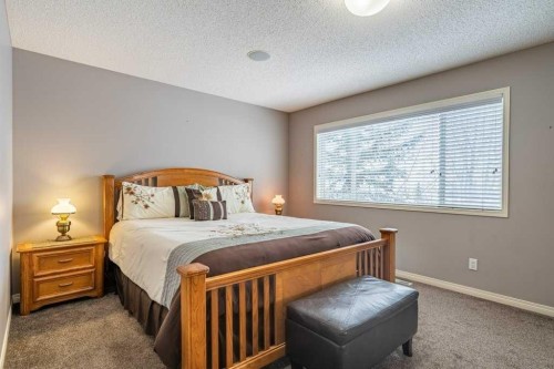 62 Springbluff Boulevard Sw, Calgary, AB - Indoor Photo Showing Bedroom