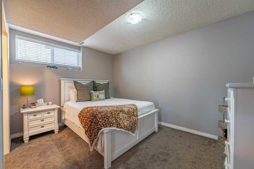 62 Springbluff Boulevard Sw, Calgary, AB - Indoor Photo Showing Bedroom