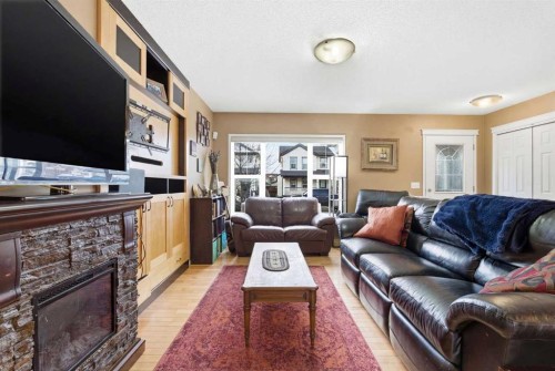 39 Copperfield Terrace Se, Calgary, AB - Indoor Photo Showing Living Room With Fireplace