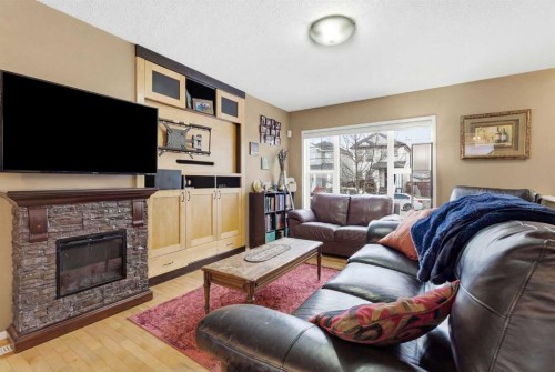 39 Copperfield Terrace Se, Calgary, AB - Indoor Photo Showing Living Room With Fireplace