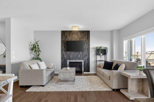 220 Evansborough Way Nw, Calgary, AB - Indoor Photo Showing Living Room With Fireplace
