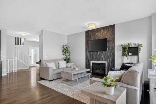 220 Evansborough Way Nw, Calgary, AB - Indoor Photo Showing Living Room With Fireplace