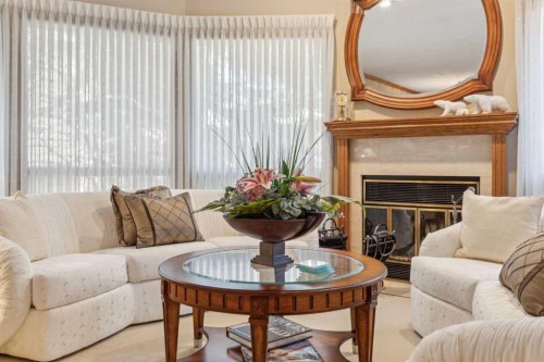 9948 Patton Road Sw, Calgary, AB - Indoor Photo Showing Living Room With Fireplace