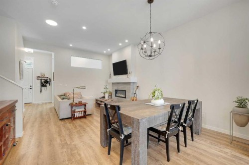 175 Magnolia Way Se, Calgary, AB - Indoor Photo Showing Dining Room With Fireplace