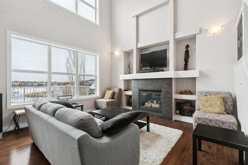 248 Copperpond Circle Se, Calgary, AB - Indoor Photo Showing Living Room With Fireplace