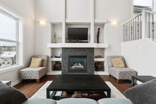 248 Copperpond Circle Se, Calgary, AB - Indoor Photo Showing Living Room With Fireplace