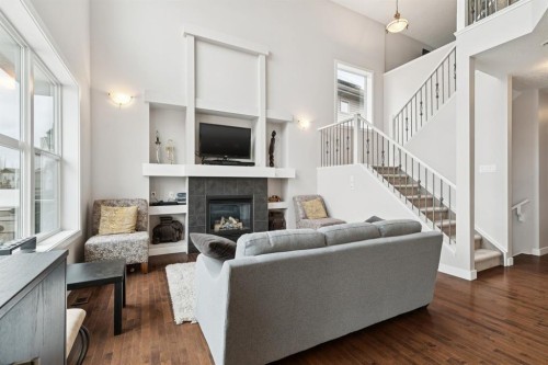 248 Copperpond Circle Se, Calgary, AB - Indoor Photo Showing Living Room With Fireplace