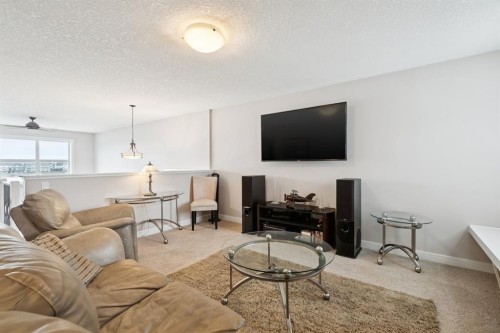 248 Copperpond Circle Se, Calgary, AB - Indoor Photo Showing Living Room