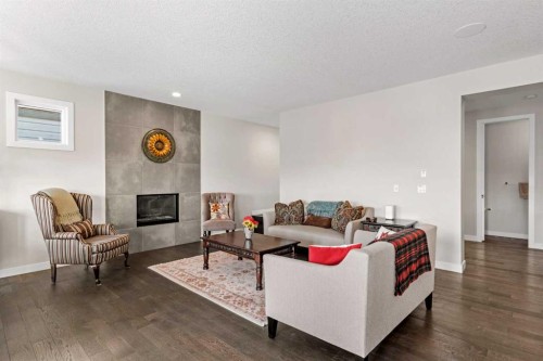82 Cranbrook Crescent Se, Calgary, AB - Indoor Photo Showing Living Room With Fireplace