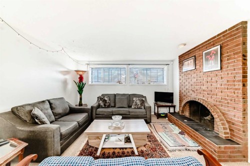 7160 Temple Drive Ne, Calgary, AB - Indoor Photo Showing Living Room With Fireplace