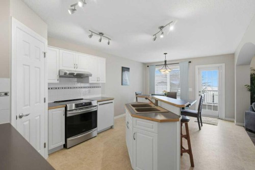 34 Arbour Stone Rise Nw, Calgary, AB - Indoor Photo Showing Kitchen With Double Sink